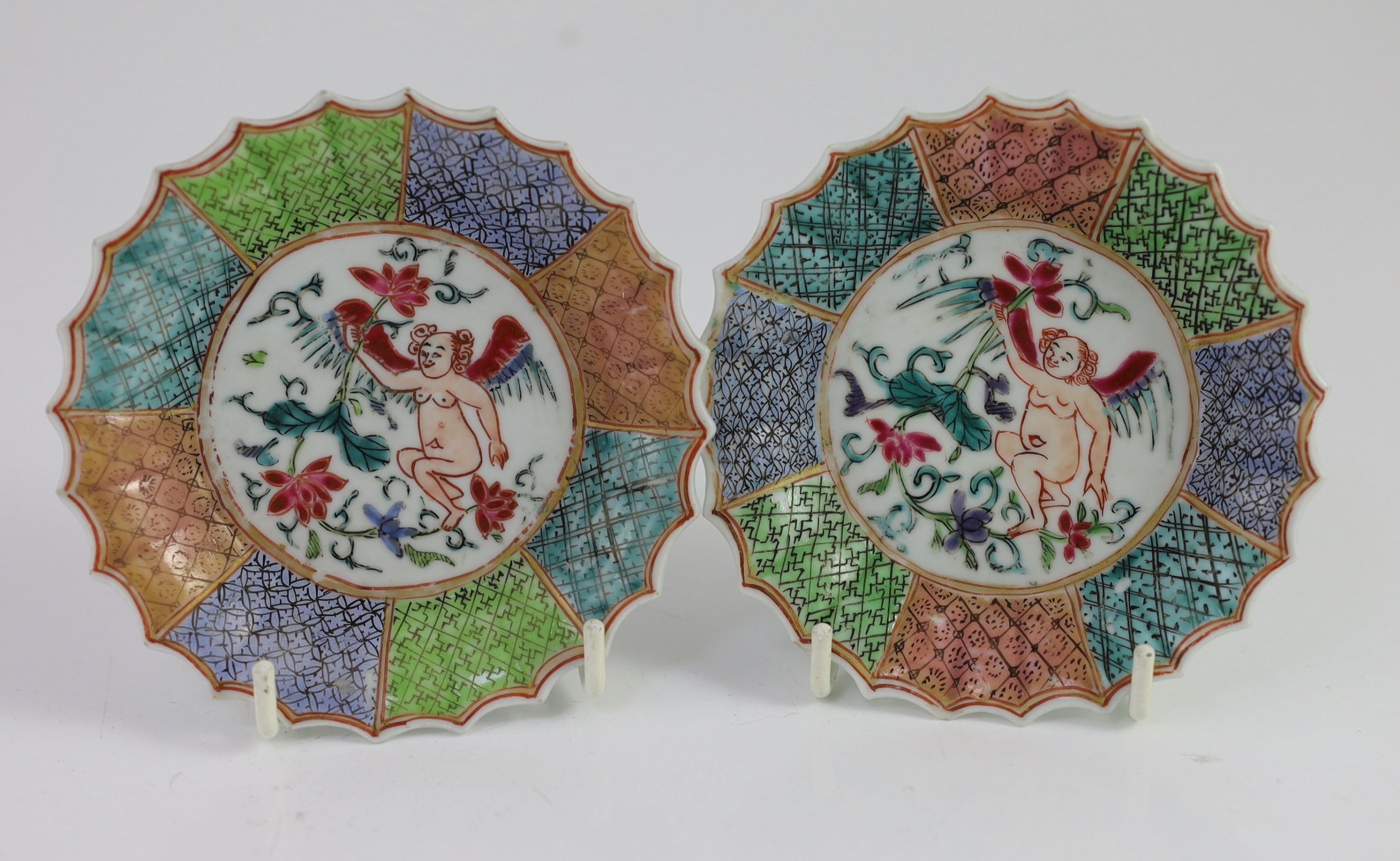 A pair of Chinese famille rose petal fluted tea bowls and saucers, Yongzheng period, saucer 10.5cm diameter